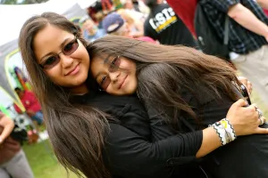 A mother hugs her child